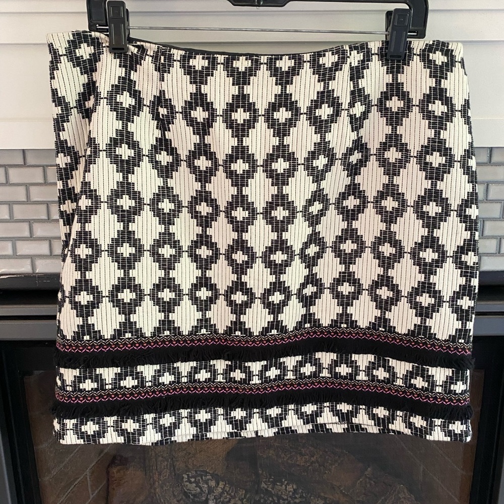 Black and white patterned skirt with pink and fringe detail